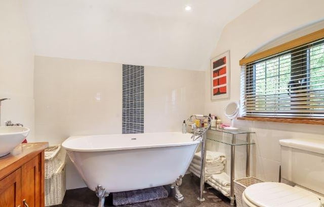 The second bedroom looks out across the rear garden and has a newly fitted en suite shower room. The third bedroom is a double aspect and is serviced by the family bathroom with a free standing 'Clawfoot' bath and separate walk-in shower.