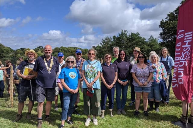 Burgess Hill town mayor Janice Henwood at the orchard opening with representatives from Lost Woods team, Burgess Hill District Rotary, Central Sussex Rotary, Burgess Hill Swift Supporters, Girlguiding and Burgess Hill Creative Community.