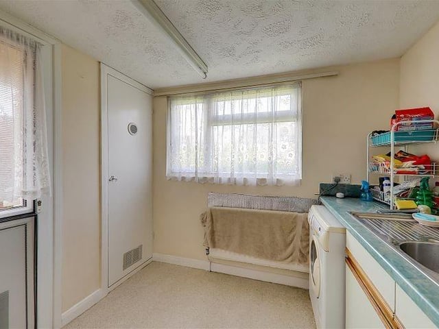 There is the benefit of a separate utility room with access to the garden