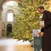Cathedral Verger Ben collects donations (Chloe Webb, 2022)