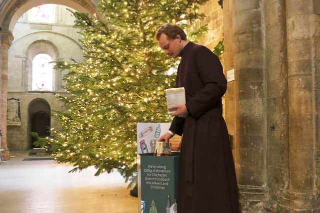 Cathedral Verger Ben collects donations (Chloe Webb, 2022)