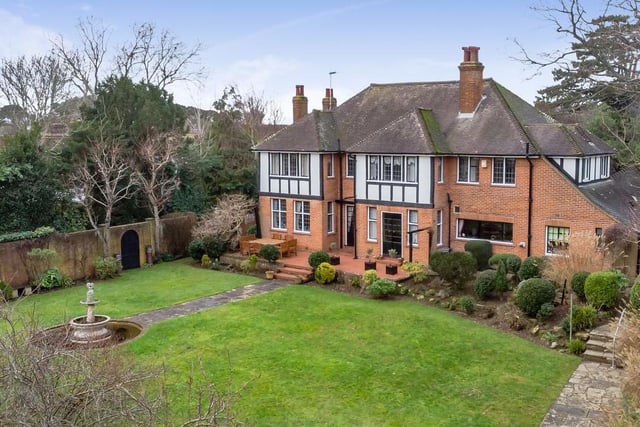 This substantial, detached 1920s home has five bedrooms, four bathrooms and four reception rooms. Outside there are two brick built outbuildings an external WC, a wooden shed and summer house. It is on the market for £1,350,000.