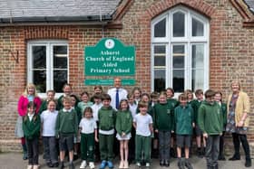 Andrew Griffith with Headteacher Sarah Smith (far left) and children of Ashurst CofE Primary School