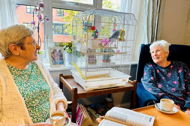 Mary and Jo with their budgie Dusky