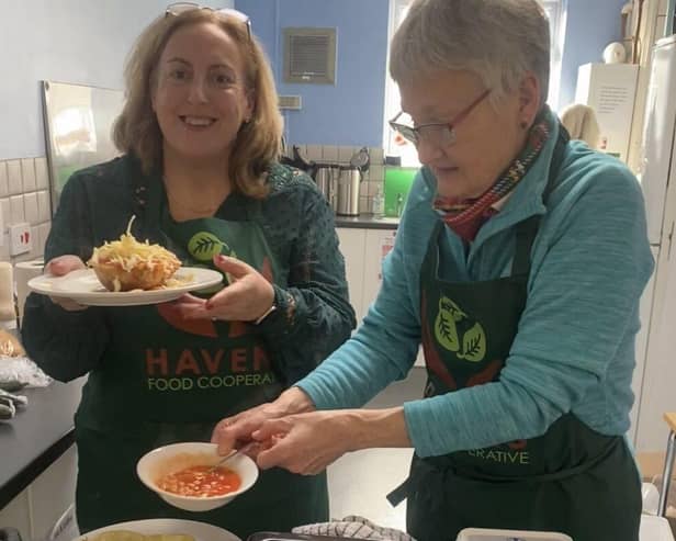 Lynda and Suzanne- two of the volunteers cooking the community meals