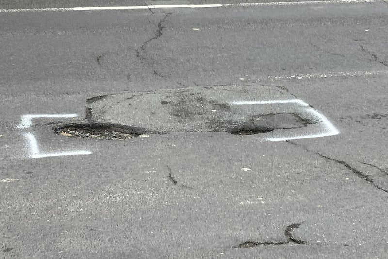 The potholes in St Leonard's Road have been 'marked' for repair but the menace remains for drivers and cyclists