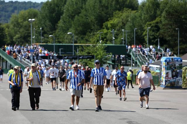 BRIGHTON, ENGLAND - AUGUST 13: Fans of Brighton & Hove Albion make their way towards the stadium prior to the Premier League match between Brighton & Hove Albion and Newcastle United at American Express Community Stadium on August 13, 2022 in Brighton, England. (Photo by Steve Bardens/Getty Images)