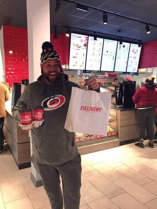 Paul Shannon was the first person to walk through the doors of the new Tim Hortons in Chichester which opened this morning at 7am. 
By doing so, he has won himself a year supply of coffee.
Pic courtesy of V2 radio
