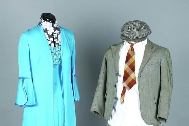 A Norman Wisdom suit and a blue dress and gown worn by Dame Vera Lynn on television, which are being auctioned at Toovey’s in Sussex.