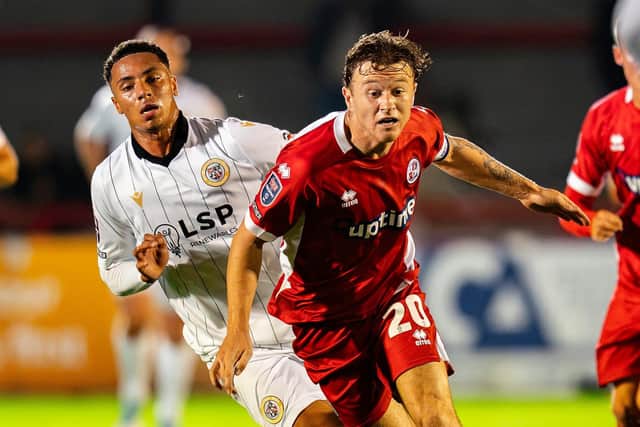 Jude Arthurs battles for the ball against Bromley | Picture: Kyle Hemsley