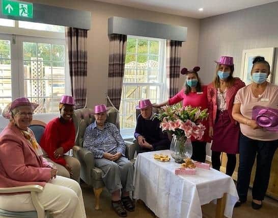 Staff and residents at Westergate House care home take part in Wear It Pink Day