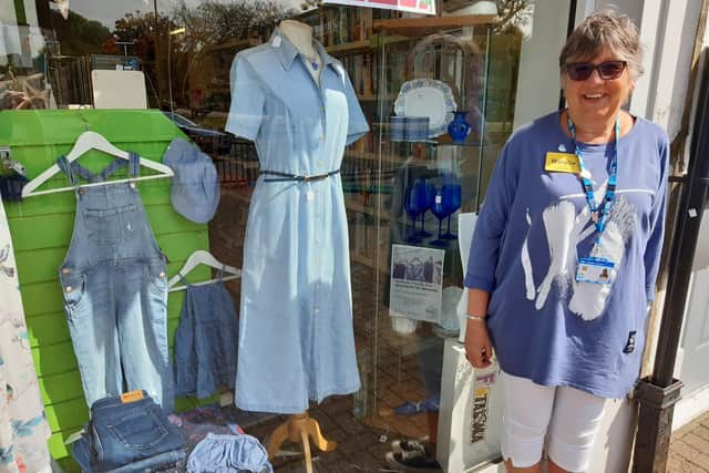 Mandie Kane, community liaison dementia nurse with Sussex Partnership Foundation NHS Trust, outside the Oxfam shop in Rustington with its blue themed window for Dementia Awareness Week