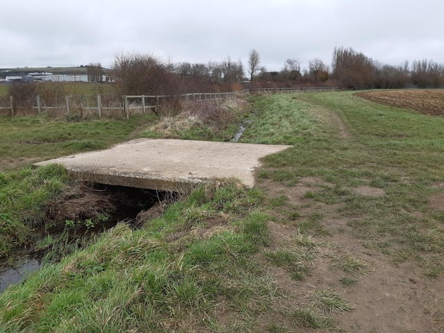 You will soon come to a brick bridge and you have to cross here to the north side to get back to Ferring Country Centre