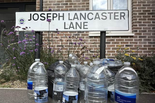 Water bottles used by residents on Joseph Lancaster Lane. Photo: Connor Gormley