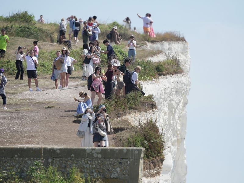 Shocking photos show sunbaskers standing near edge of cliffs at Birling Gap