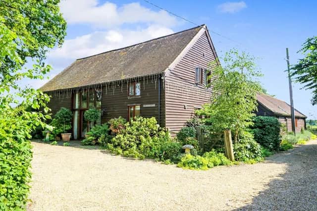 This five bed converted barn in Anmore Road, Denmead is on the market for £1.4m. It is listed on Zoopla by White & Guard Estate Agents.
