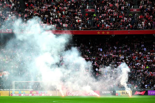 The game at the Johan Cruyff Arena had already been paused twice, after fans had thrown plastic cups and fireworks onto the pitch (Photo by Olaf Kraak / ANP / AFP) / Netherlands OUT (Photo by OLAF KRAAK/ANP/AFP via Getty Images)