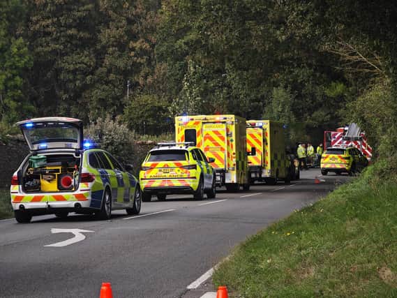 Emergency crews on the scene as a car was reported to have flipped over on the A283 near Storrington
