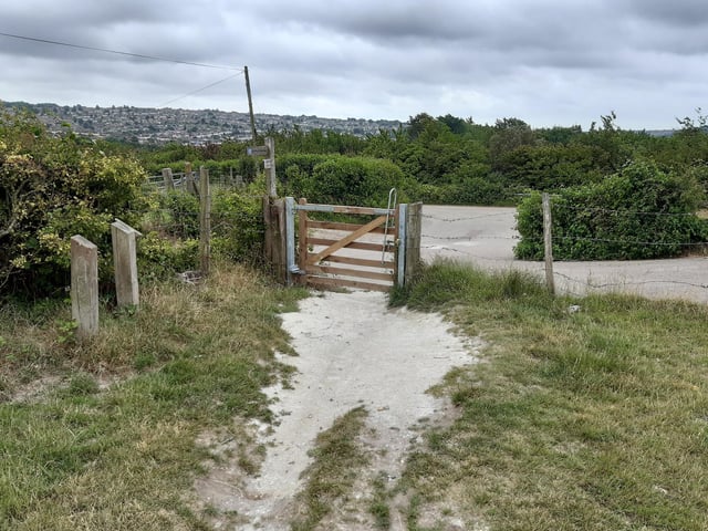 You go through this gate and end up in a small parking area.
