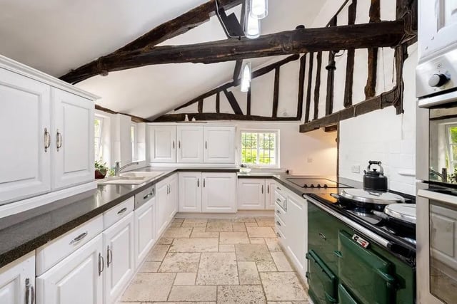 The West Wing of the property contains the kitchen with a central Aga and plenty of wall and preparation areas