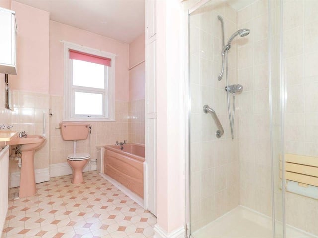 There are two family bathrooms with a bath and walk-in double shower in each
