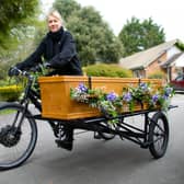 Karen Nash rides a tandem as part of a recent funeral