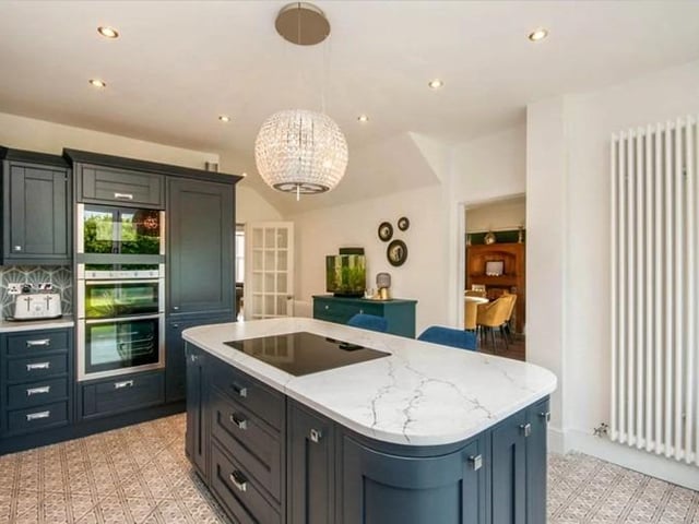 The property consists of a front porch and beautiful period entrance hallway with stairs leading to the second floor. A spacious lounge, large dining room, and a stunning fitted kitchen with island.