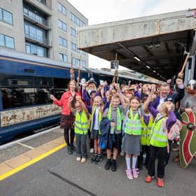 MP Helena Dollimore pictured with Hastings school children off to see the Bayeux Tapestry