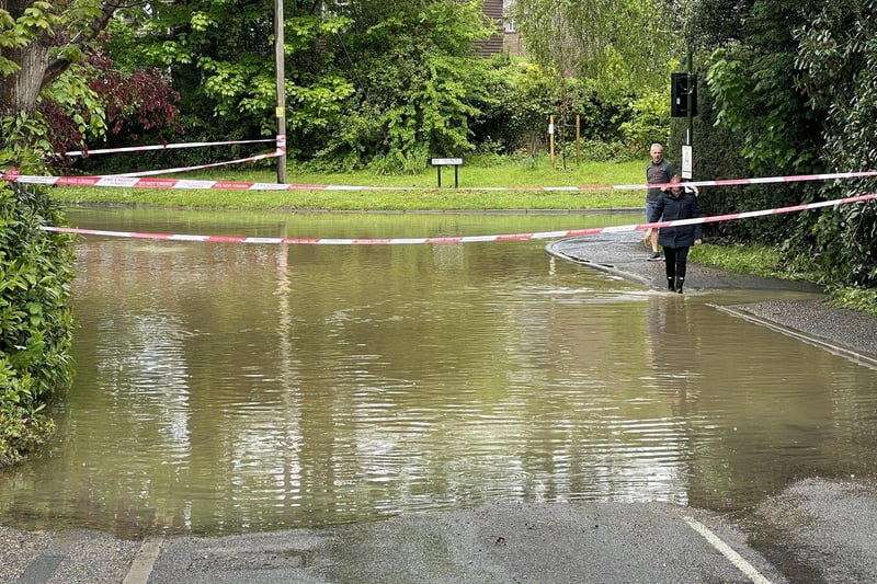 In Pictures: West Sussex road closed following heavy flooding