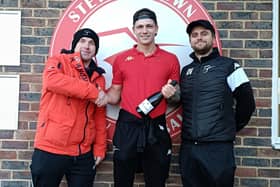 Harry Shooman picks up his Steyning MoM prize after the win over Horsham YMCA | Picture: Steyning Town FC