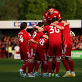 Liam Kelly of Crawley Town celebrates scoring his team's first goal with teammates during the Sky Bet League Two Play-Off Semi-Final 1st Leg match between Crawley Town and Milton Keynes Dons at Broadfield Stadium on May 07, 2024 in Crawley, England. (Photo by Steve Bardens/Getty Images)