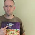 Steven Bailey holding a gluten free pizza. Photo: contributed