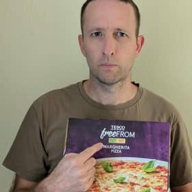 Steven Bailey holding a gluten free pizza. Photo: contributed