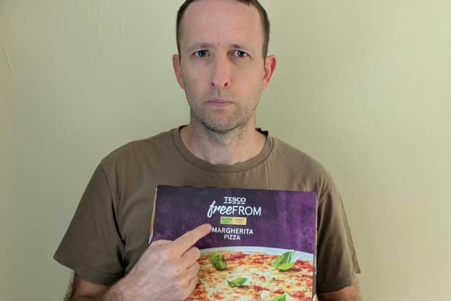 Steven Bailey holding a gluten free pizza. Photo: contributed