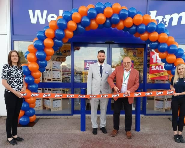 Eastbourne Foodbank CEO Howard Wardle (second from the right) opening B&M in the town