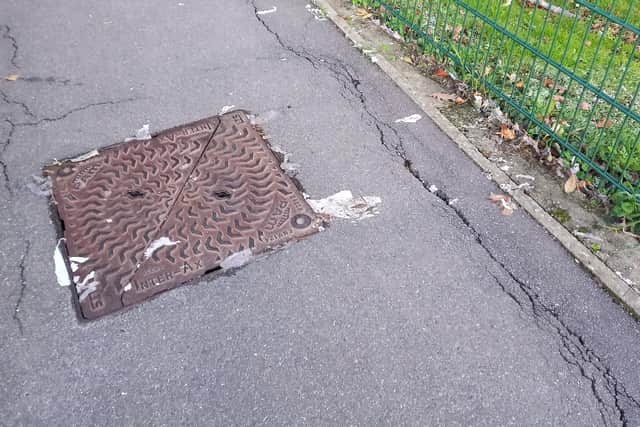 The manhole cover where the spill came from, according to Hampden Park Tennis Club