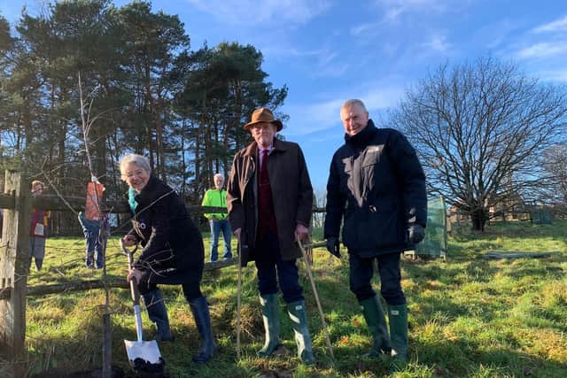 A new community orchard at West Hoathly has contributed to the Queen's Green Canopy campaign - from left Deputy Lieutenant Carole Hayward, Douglas Denham St Pinnock, Chair of the Sussex Association of Local Councils and Dr John Godfrey DL, Chair of the QGC West Sussex Task Force.