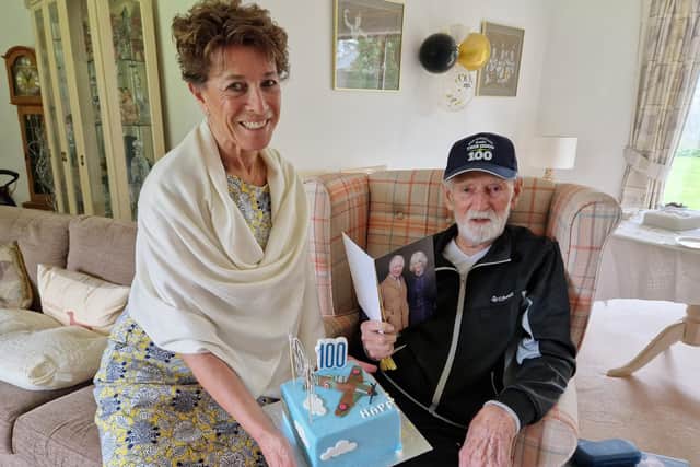 Peter Moore and his daughter Stephanie Moore with his Spitfire cake for his 100th birthday