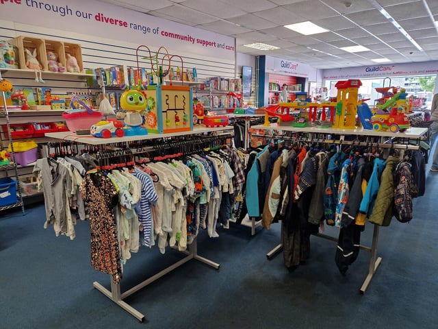 Inside Guild Care's new shop dedicated to children's toys, clothes and equipment, as influencer Jen Graham, known as Charity Shop Girl cuts the ribbon to officially open the Portland Road store