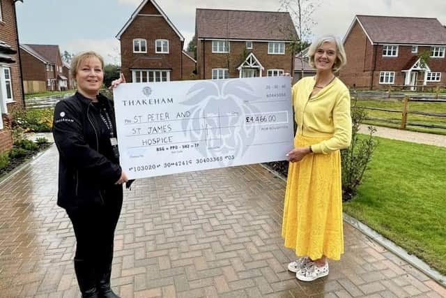 Karen Cooper from Thakeham donate over £4k to Lisa from St Peter & St James Hospice.
