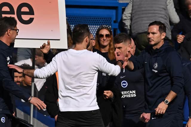 Interim Chelsea manager Frank Lampard (right) admitted his team were 'well beaten' by Roberto De Zerbi's Brighton. (Photo by BEN STANSALL/AFP via Getty Images)