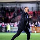 Crawley Town boss Scott Lindsey doing a trademark celebration after another win at the Broadfield Stadium. Picture: Eva Gilbert
