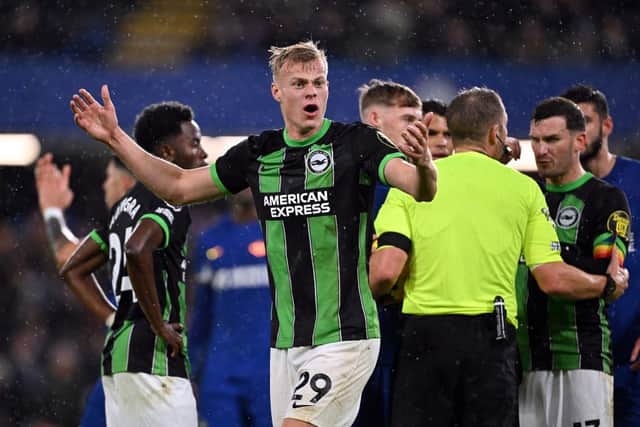 Jan Paul van Hecke of Brighton & Hove Albion reacts during the Premier League match between Chelsea FC and Brighton & Hove Albion at Stamford Bridge on December 03, 2023 in London, England. (Photo by Mike Hewitt/Getty Images)