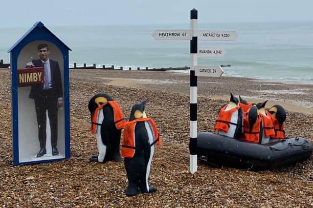 Penguin art installation on the beach