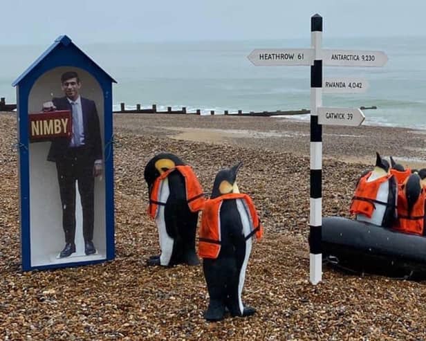 Penguin art installation on the beach
