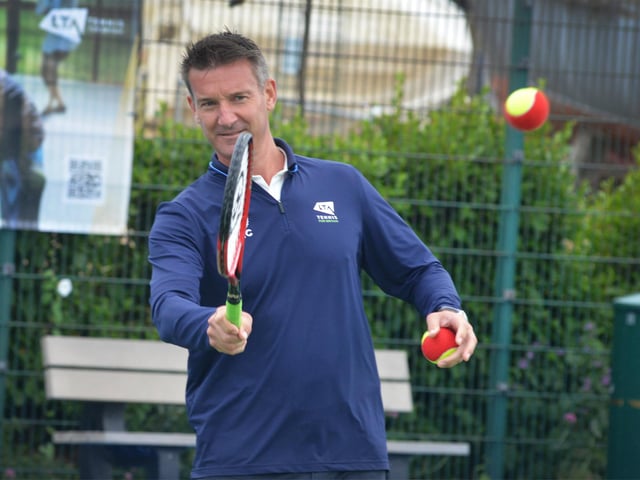 Culture Secretary Lucy Frazer marks the refurbishment of 1,000 public tennis courts. Photocall on June 29 at the tennis courts on Royal Parade, Eastbourne, with children from Bourne Primary School. Pictured here is Scott Lloyd, Lawn Tennis Association CEO.