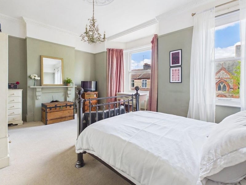 The principal bedroom is particularly impressive, spanning the full width of the property