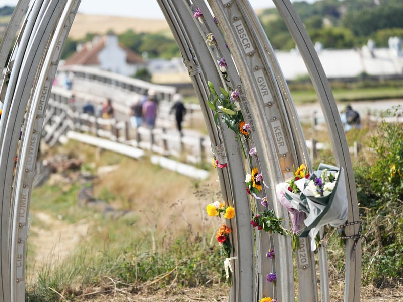 Floral tributes on the Shoreham Airshow disaster memorial