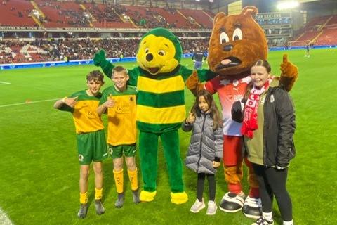 Finley and Bobby with Horsham mascot Howie the Hornet and Barnsley mascot Toby Tyke
