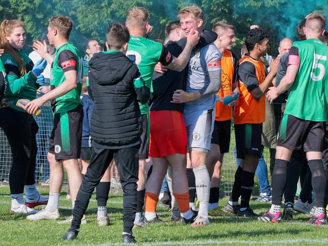 Burgess Hill Town players, fans and staff celebrate surviving in the Isthmian south east division at the end of their 0-0 draw with Beckenham
